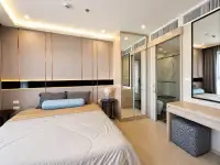 1 Bedroom Condo for Rent at The Panora Pattaya bedroom with mirrored closet and en-suite glass shower