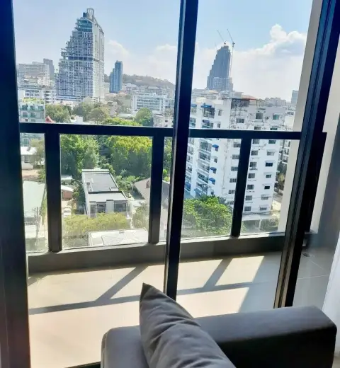 Studio Condo for Rent at The Panora Pattaya balcony view of Pattaya skyline and city buildings