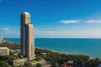 1 Bedroom Condo for Sale at The Panora Pattaya aerial daytime view of beachfront high-rise tower and coastline