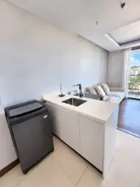 1 Bedroom Condo for Rent at The Peak Towers kitchenette with white countertop sink and washing machine