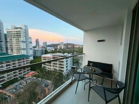 1 Bedroom Condo for Sale & Rent at The Peak Towers balcony seating area with sunset city skyline view