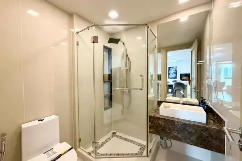 2 Bedroom Condo for Rent at The Peak Towers bathroom with glass shower enclosure and marble vanity