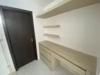 1 Bedroom Condo for Sale at The Place Pratumnak built-in wooden desk and floating shelves by entrance door
