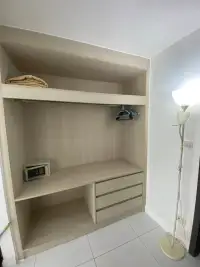 1 Bedroom Condo for Sale at The Place Pratumnak open wardrobe closet with safe box and hanging rail