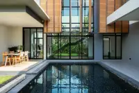 3 Bedroom House for Sale at The Prospect private outdoor pool with dining area and glass staircase view