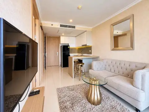 1 Bedroom Condo for Rent at The Riviera Jomtien hallway view of lounge, kitchen counter and sofa