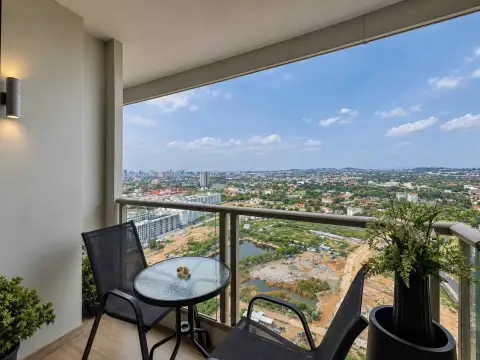 1 Bedroom Condo for Rent at The Riviera Jomtien private balcony with city and lake view