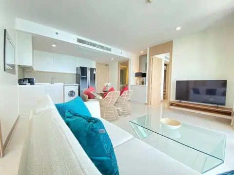 2 Bedroom Condo for Sale at The Riviera Jomtien open-plan kitchen and lounge with glass coffee table