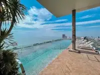1 Bedroom Condo for Sale at The Riviera Jomtien rooftop infinity pool with panoramic sea and city view
