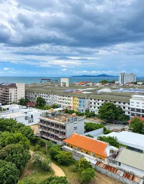Studio Condo for Sale at The Riviera Jomtien rooftop view of Jomtien coastline and surrounding neighborhood