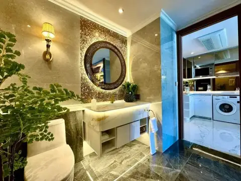 1 Bedroom Condo for Sale at The Riviera Malibu bathroom with mosaic mirror leading to kitchen area