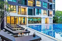 1 Bedroom Condo for Sale at The Rizin Hotel & Residences outdoor pool with loungers and gym view