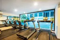 1 Bedroom Condo for Sale at The Rizin Hotel & Residences fitness center with treadmills overlooking pool