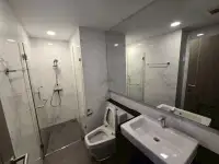 2 Bedroom Condo for Sale at The Senate Residences marble bathroom with glass-enclosed shower and double vanity sinks