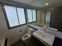 2 Bedroom Condo for Sale at The Senate Residences bathroom with frosted windows, toilet and marble countertop sink