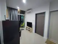 1 Bedroom Condo for Rent at The Twin Tower Jomtien Beach Pattaya entryway with TV stand, air conditioner, and bedroom door