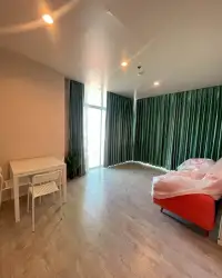 2 Bedroom Condo for Sale at The Twin Tower Jomtien Beach Pattaya living room with green curtains and red sofa