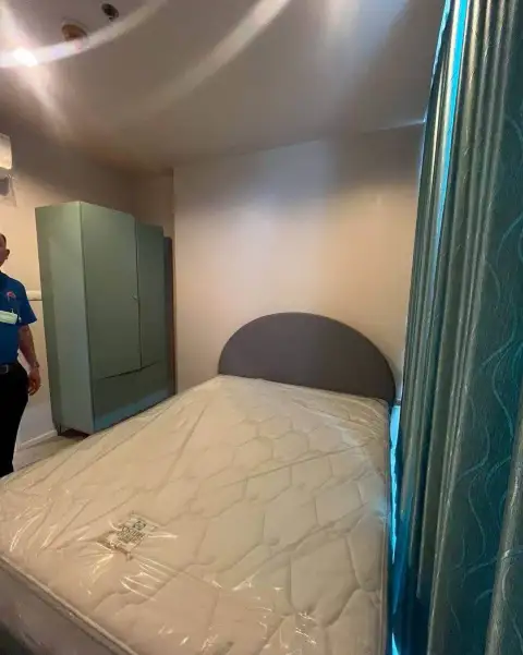2 Bedroom Condo for Sale at The Twin Tower Jomtien Beach Pattaya second bedroom with wardrobe and wrapped mattress