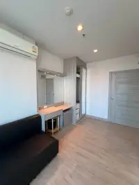 1 Bedroom Condo for Rent at The Twin Tower Jomtien Beach Pattaya living area with wardrobe, mirror, and sofa