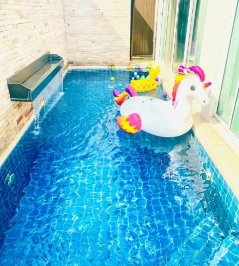 3 Bedroom House for Rent at The Ville Jomtien private pool with waterfall feature and inflatable unicorn float