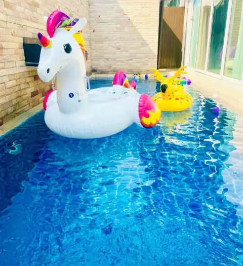 3 Bedroom House for Rent at The Ville Jomtien poolside view with colorful unicorn and deer inflatable floats