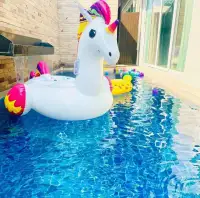 3 Bedroom House for Rent at The Ville Jomtien poolside view with unicorn float and water feature wall