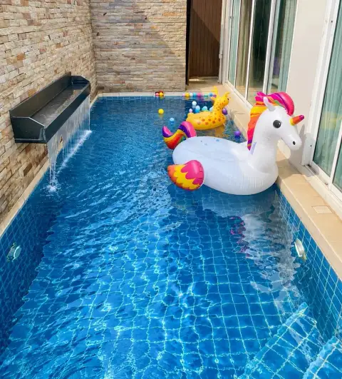 3 Bedroom House for Rent at The Ville Jomtien private pool with waterfall feature and inflatable unicorn float