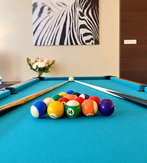 3 Bedroom House for Rent at The Ville Jomtien game room with pool table, cue sticks, and zebra wall art