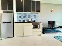 1 Bedroom Condo for Sale at The Vision compact kitchenette with fridge, microwave and mosaic tile backsplash