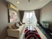 1 Bedroom Condo for Sale at The Vision living room with sofa, TV, balcony access, and city view