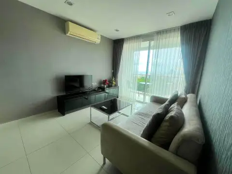 1 Bedroom Condo for Sale at The Vision living room with sofa, TV unit and balcony with sheer curtains