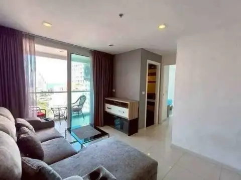 1 Bedroom Condo for Sale at The Vision living room with gray sofa, glass coffee table, and balcony access