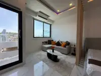 Studio Condo for Sale at Thepthip Mansion Condominium balcony entrance beside lounge area with sofa and high-rise city view