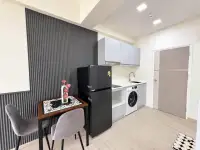 Studio Condo for Rent at Thian Tong Condotel kitchenette with fridge, washing machine, and dining table