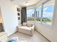 Studio Condo for Rent at Thian Tong Condotel cozy reading nook with bay windows overlooking Pattaya skyline and sea