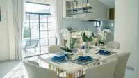 4 Bedroom House for Sale in Jomtien elegant dining room with marble table set for six