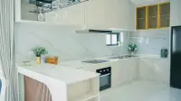 4 Bedroom House for Sale in Jomtien modern kitchen with marble backsplash and built-in oven