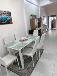 2 Bedroom Townhouse for Rent in East Pattaya dining space with wooden cabinet and hallway to entrance