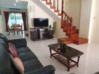 2 Bedroom Townhouse for Rent in Pratumnak Hill open living and dining area with staircase and TV unit