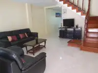 2 Bedroom Townhouse for Rent in Pratumnak Hill lounge with TV console and staircase to upper floor