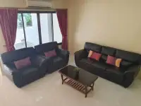 2 Bedroom Townhouse for Rent in Pratumnak Hill seating area with leather armchairs and sofa near window