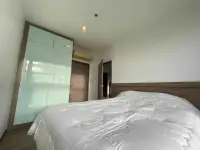 1 Bedroom Condo for Sale at Treetops Condo bedroom with built-in wardrobe and air conditioning unit