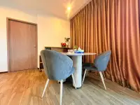 2 Bedroom Condo for Sale at Treetops Condo small dining area with round marble table and upholstered chairs