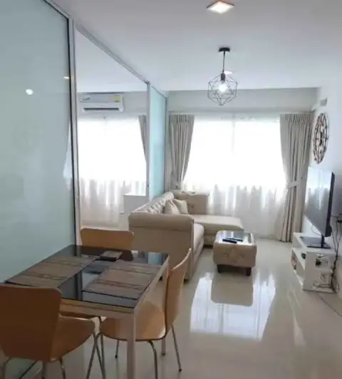 2 Bedroom Condo for Rent at Trio Gems open living room with dining table, sofa and TV unit
