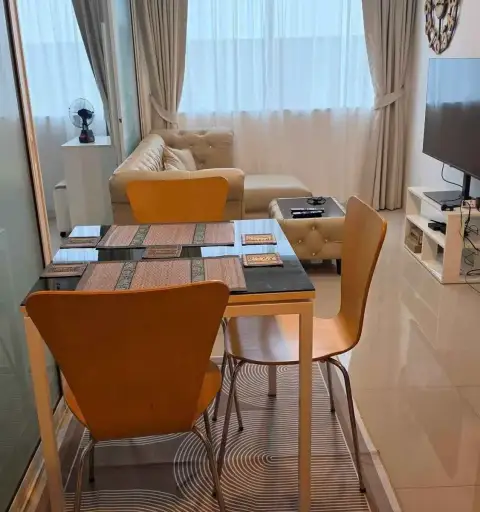 2 Bedroom Condo for Rent at Trio Gems dining table with wooden chairs beside lounge area