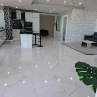 3 Bedroom Condo for Sale at Tropicana Pratumnak open-plan kitchen and living room with marble tile floors