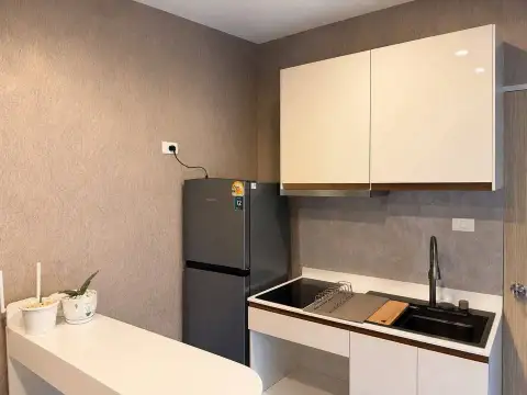 1 Bedroom Condo for Sale at The Twin Tower Jomtien Beach Pattaya compact kitchenette with sink and refrigerator