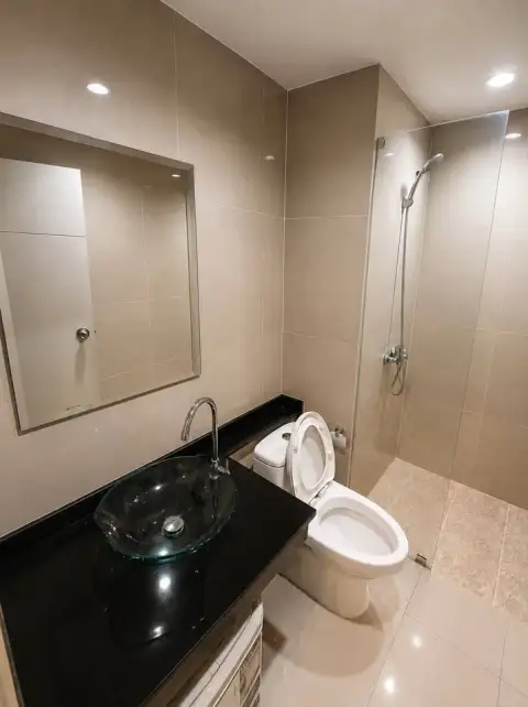 1 Bedroom Condo for Sale at The Twin Tower Jomtien Beach Pattaya bathroom with glass sink and walk-in shower