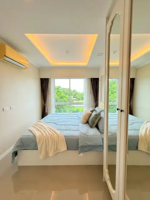 1 Bedroom Condo for Sale at The Orient Resort & Spa second bedroom with mirrored closet and garden view