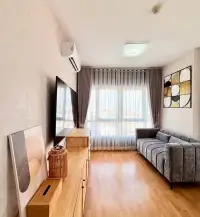 2 Bedroom Condo for Rent at Unicca spacious living room with sofa, large window and city view